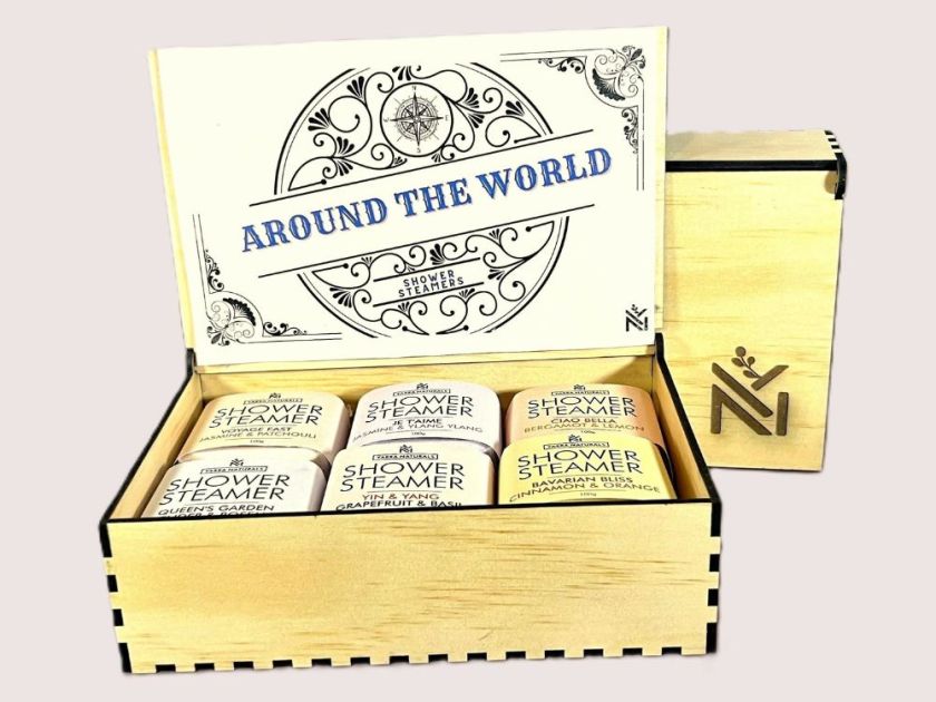 Promotional image of Around The World shower steamers in a wooden keepsake box
