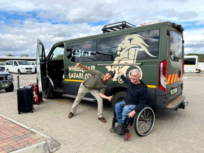 Malcolm Turnbull and a driver giving thumbs up in front of a wheelchair accessible branded safari airport transfer van